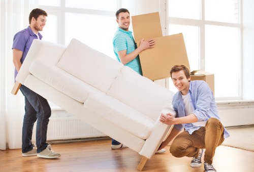 Staff using team communication during a safe removals operation