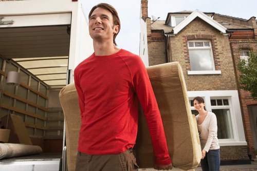 Packed boxes and furniture being loaded from a South Kensington apartment