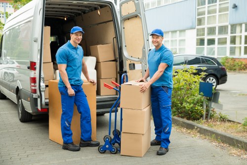 Mover wearing PPE while securing items for transport