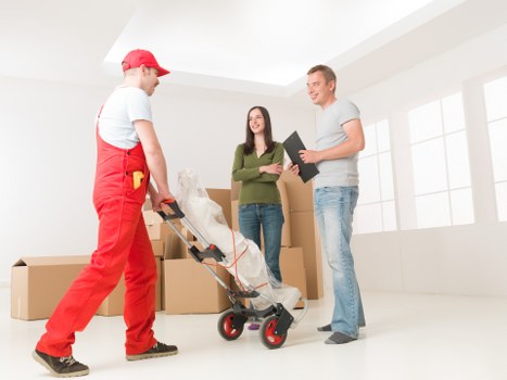 Local movers handling office furniture in a South Kensington building