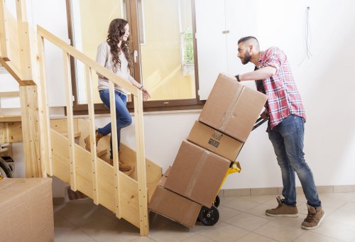 Team applying health and safety practices during a professional house move