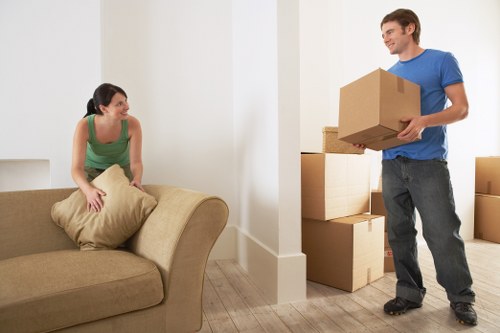 Packed office equipment ready for commercial moves in South Kensington
